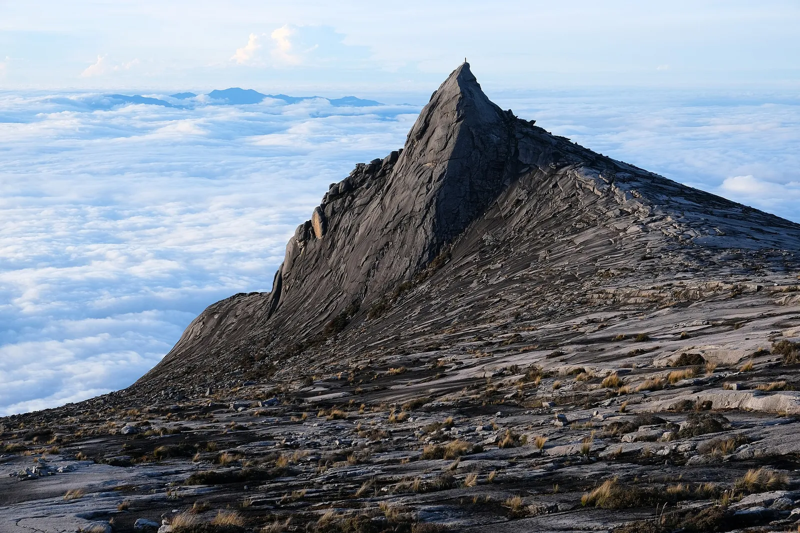South Peak granite formation above clouds on Mount Kinabalu