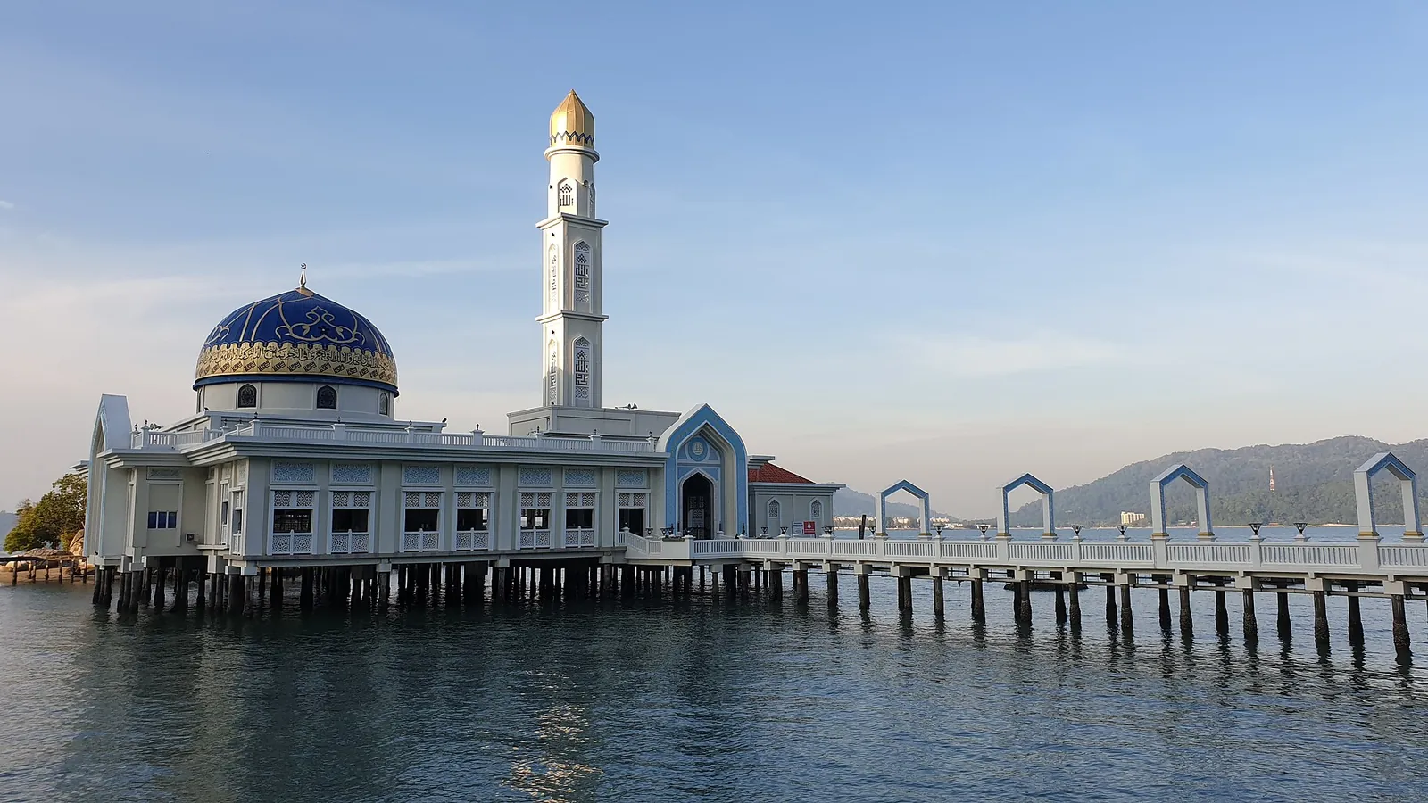 Blue-domed mosque and minaret beside the water on Pangkor Island
