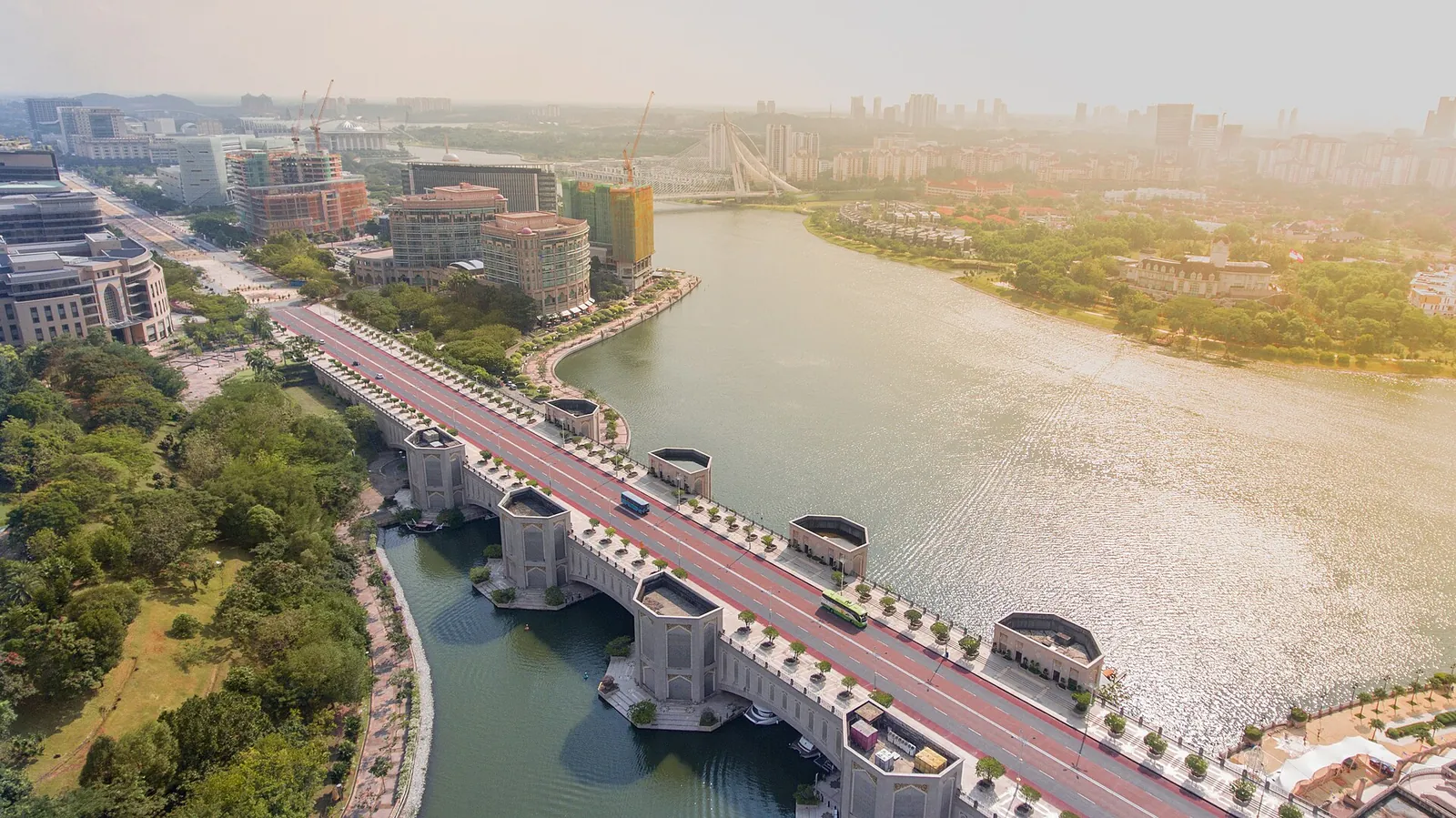 Elevated view of Putrajaya lake and bridge in warm daylight