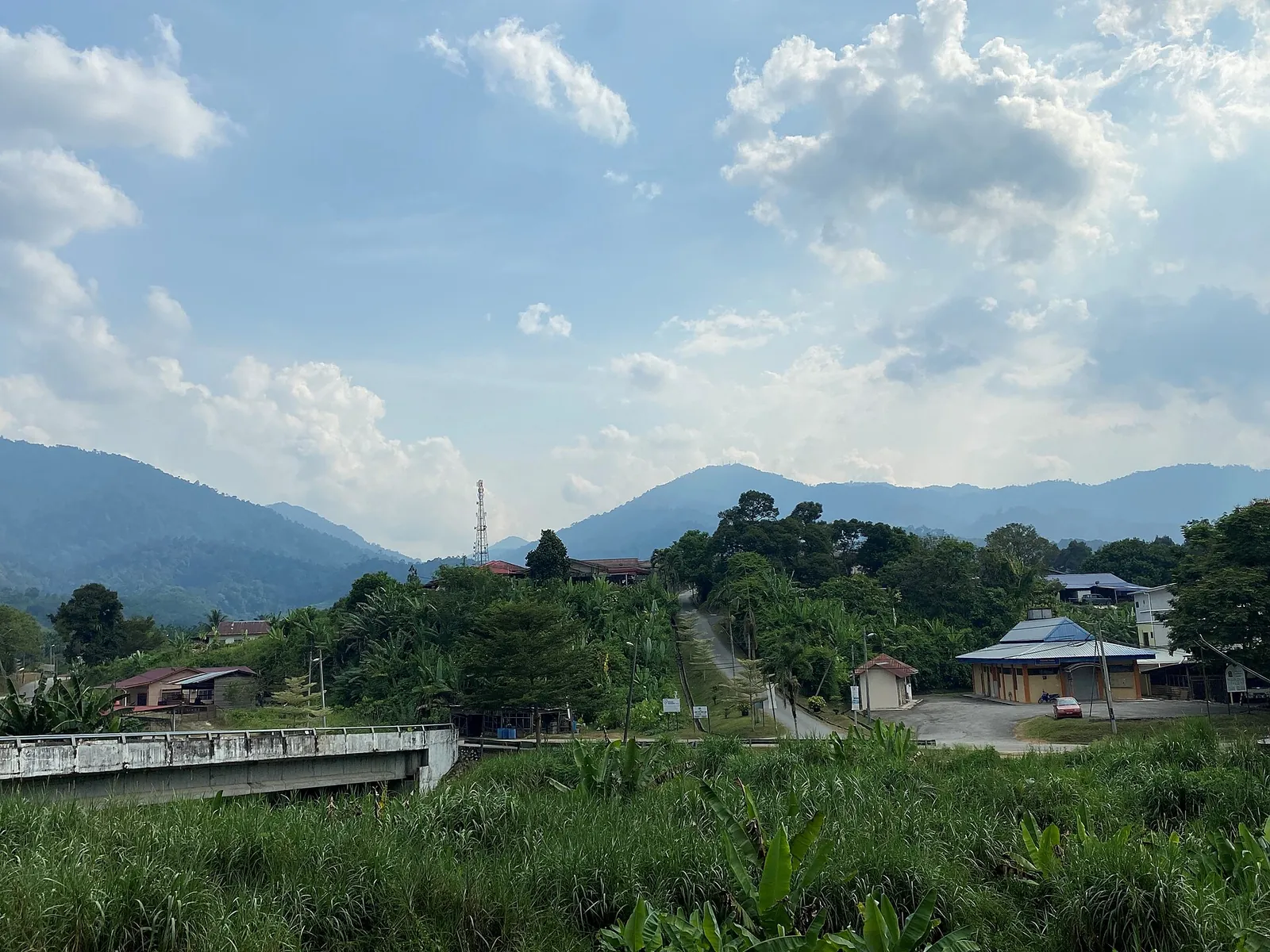 Green hills and village buildings at Kampung Baru Teras outside Raub