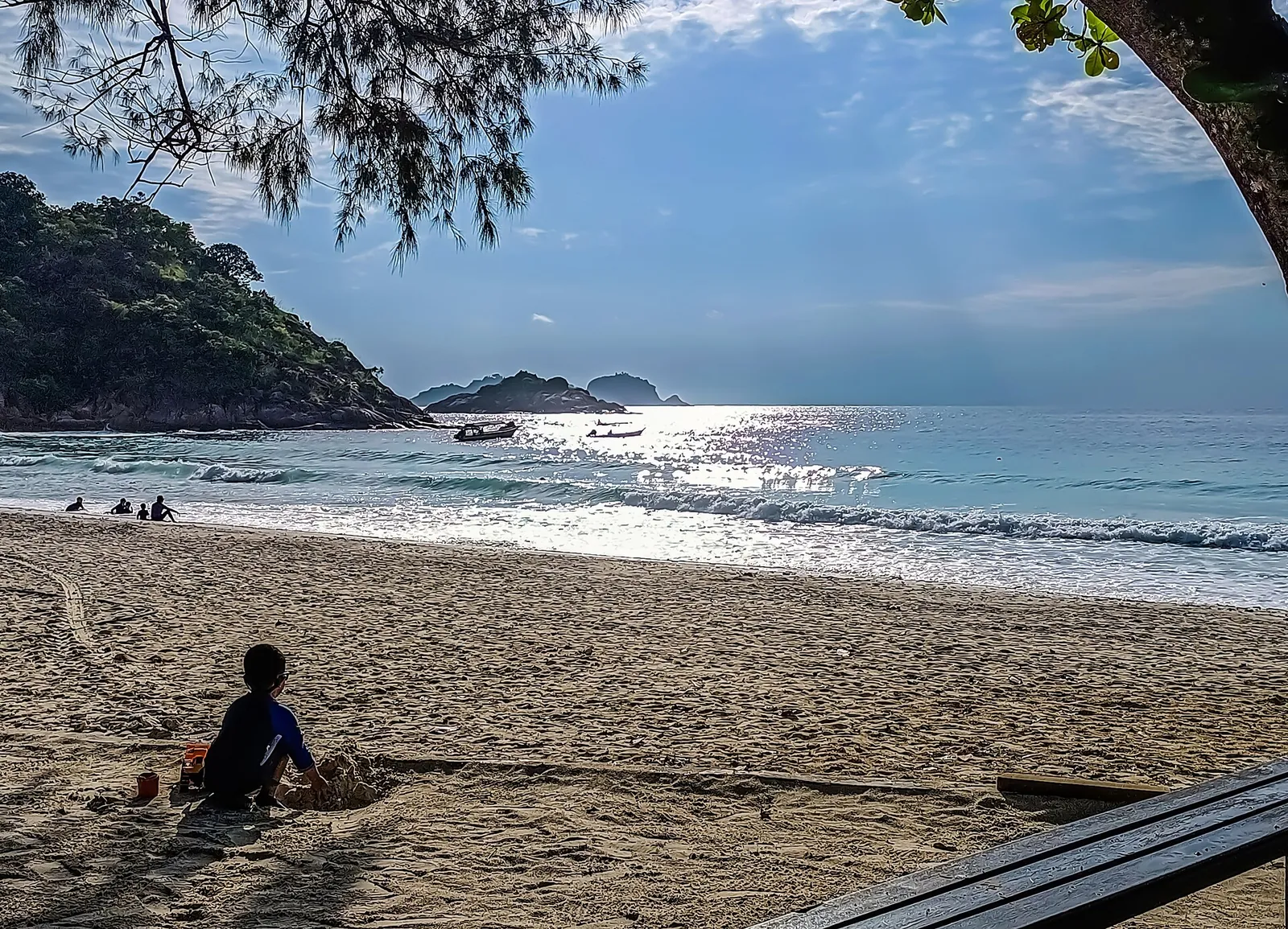 Sandy shoreline and forested headland at Teluk Dalam on Redang Island