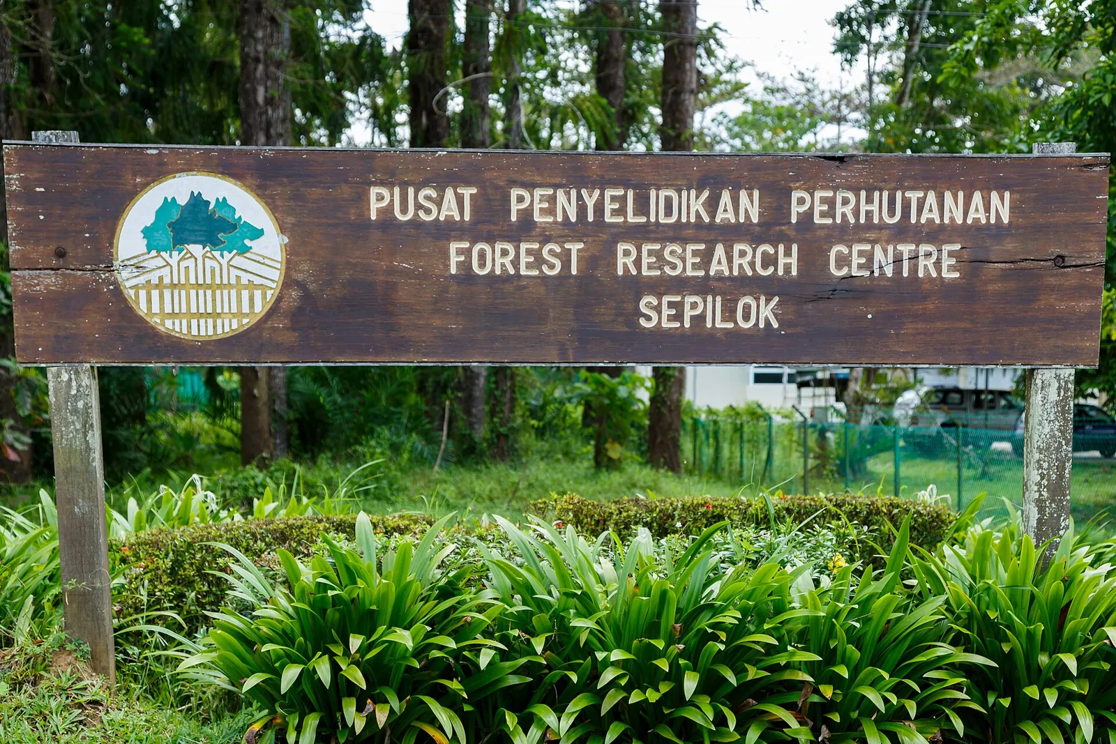 Forest Research Centre sign among trees in Sepilok