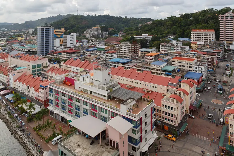 Red-roofed buildings across Sandakan old town viewed from Harbour Mall
