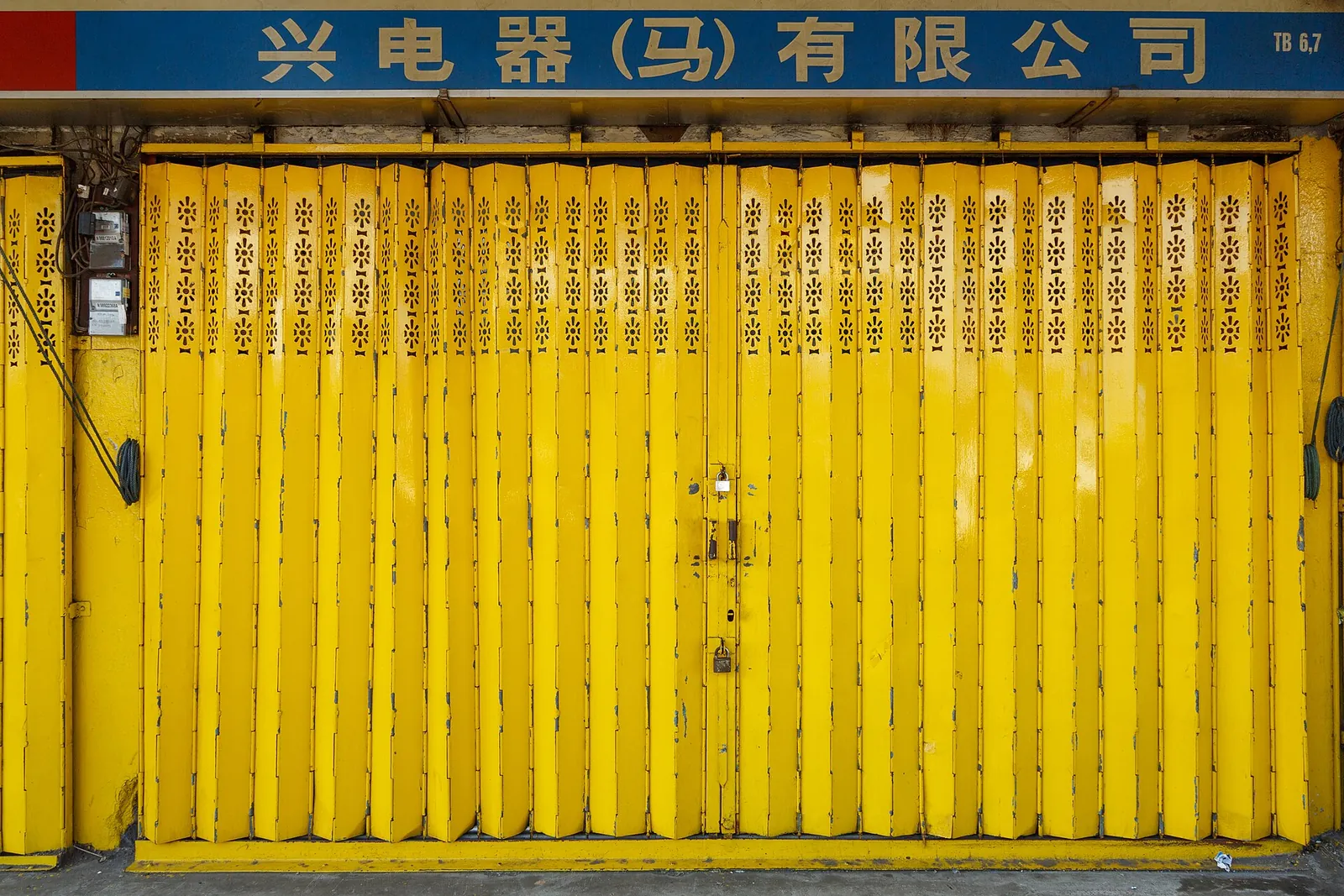 A yellow shopfront shutter on Dunlop Street in Tawau