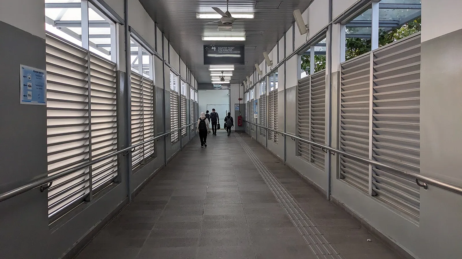 A covered pedestrian walkway linking Butterworth railway station and the ferry terminal
