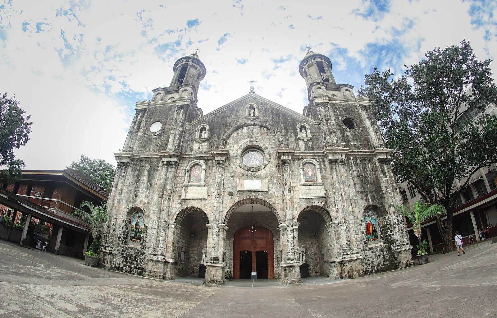 Stone facade and twin towers of San Sebastian Cathedral in Bacolod