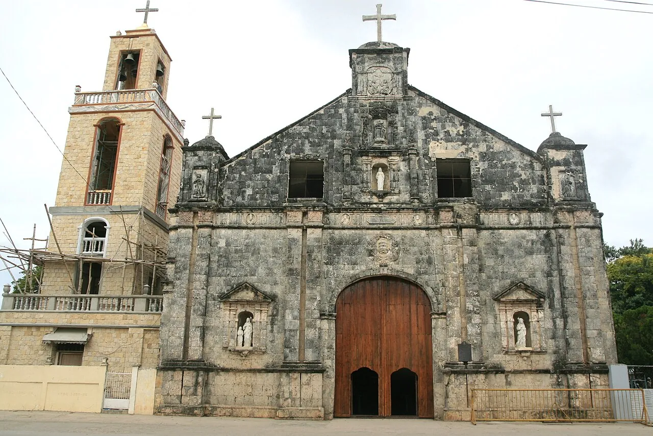 Stone church frontage and bell tower at Saints Peter and Paul Church in Bantayan