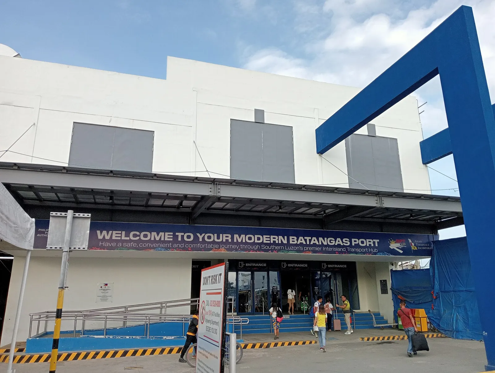 Modern Batangas Port entrance beneath a blue structural frame