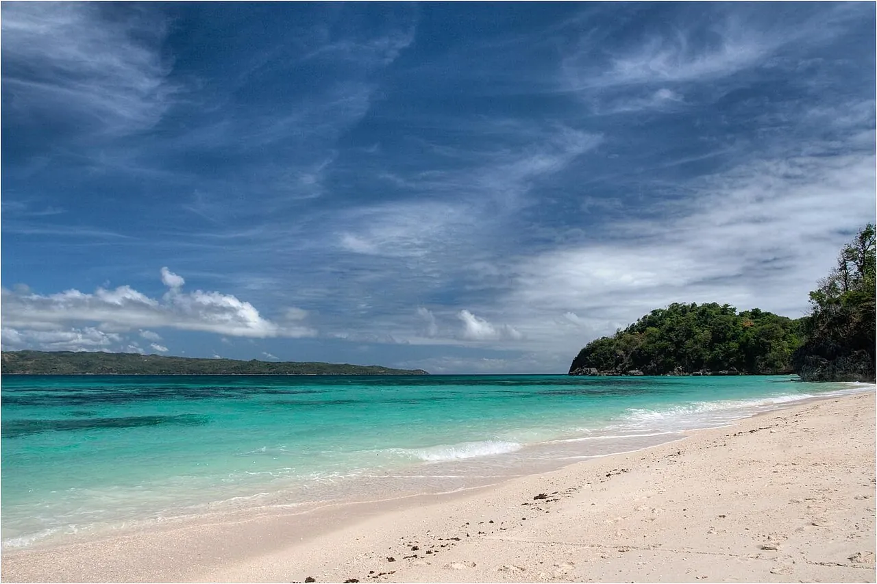 Pale sand and turquoise water at Puka Beach on Boracay