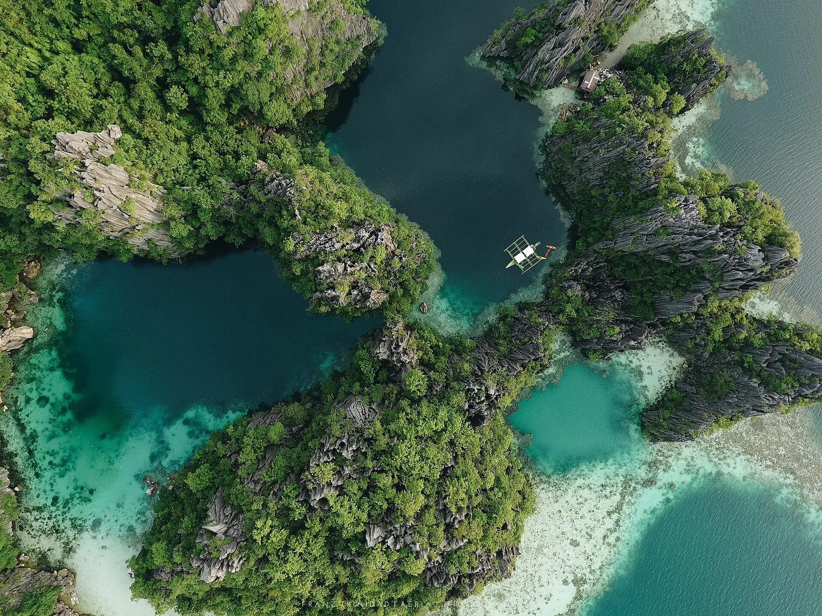 Turquoise channels and limestone cliffs seen from above Twin Lagoon in Coron