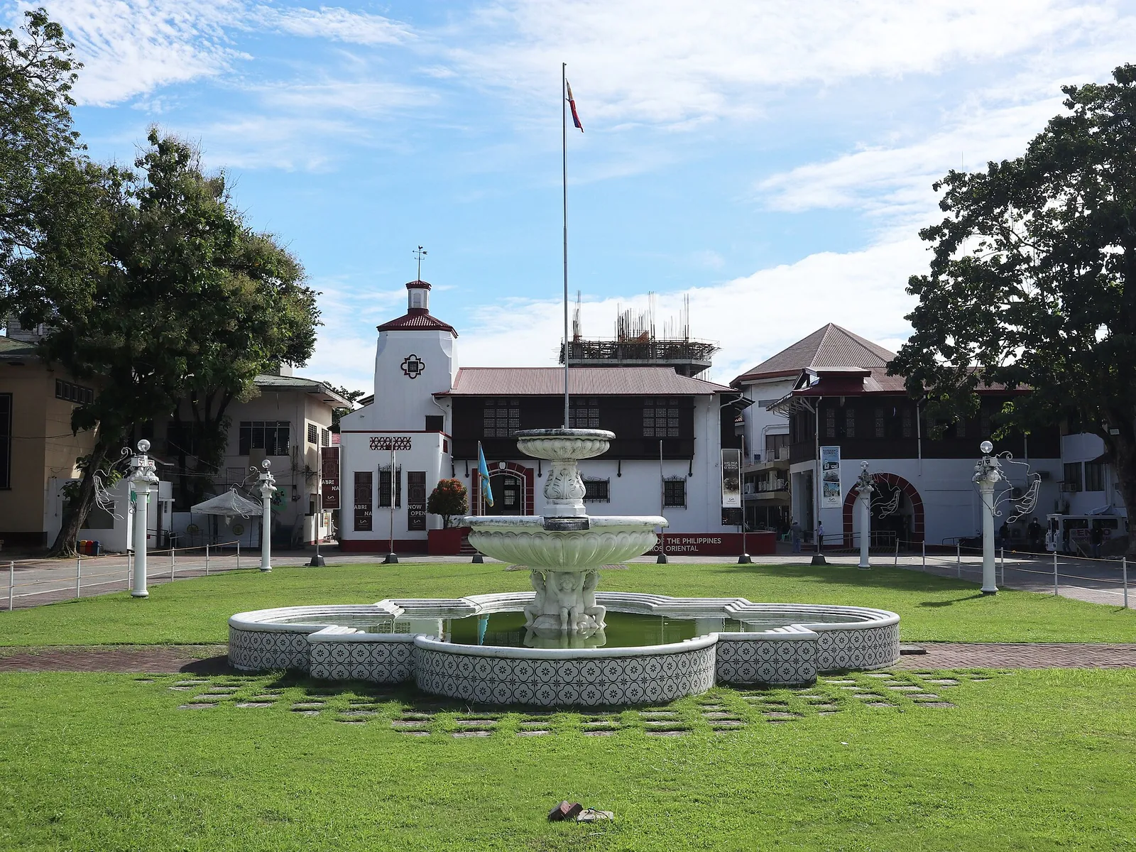 Fountain and landscaped lawn in front of the National Museum building in Dumaguete
