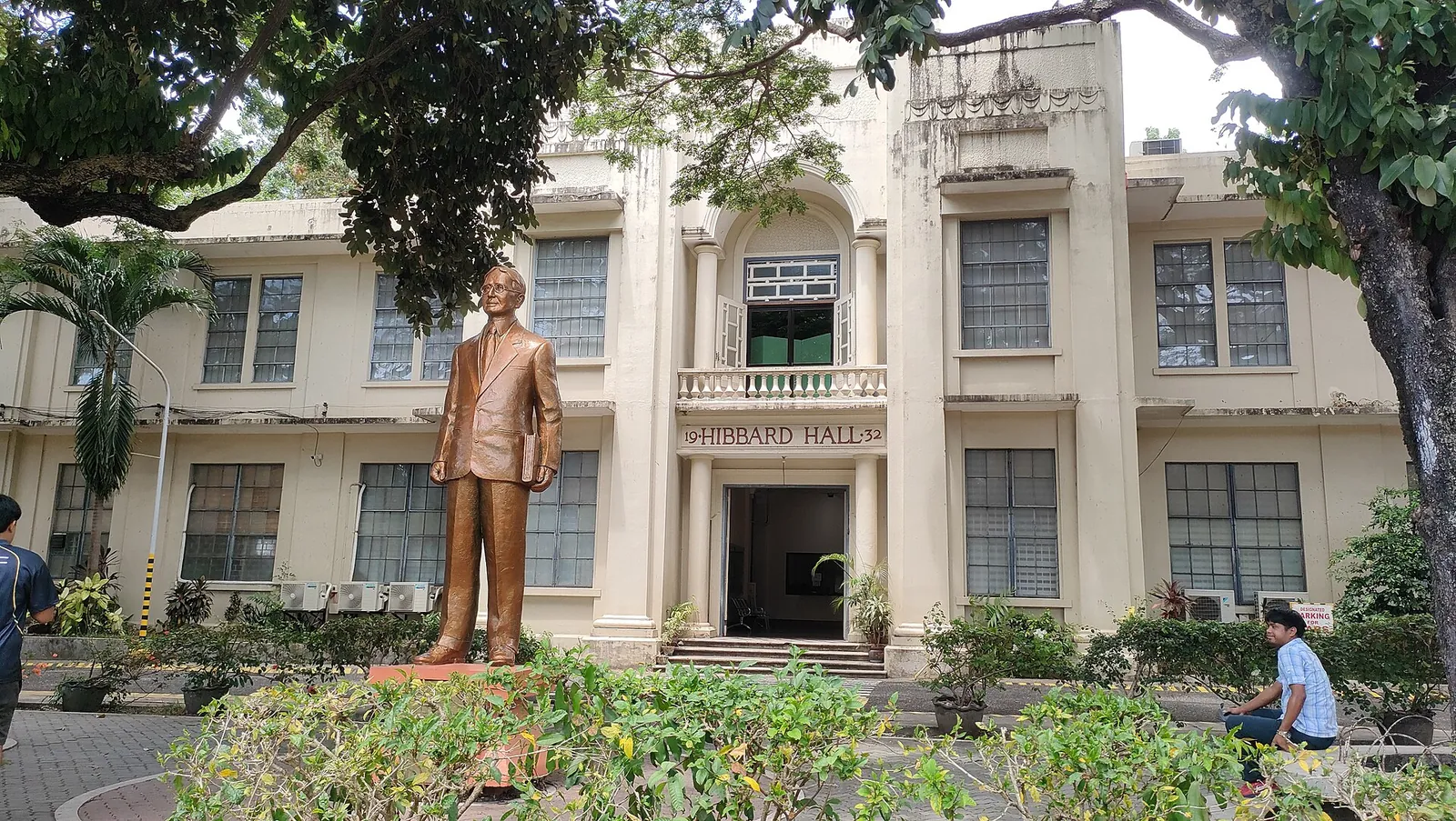 David Hibbard monument amid gardens in front of Hibbard Hall at Silliman University