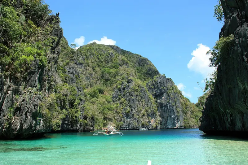 Turquoise water beneath limestone cliffs at Big Lagoon in El Nido