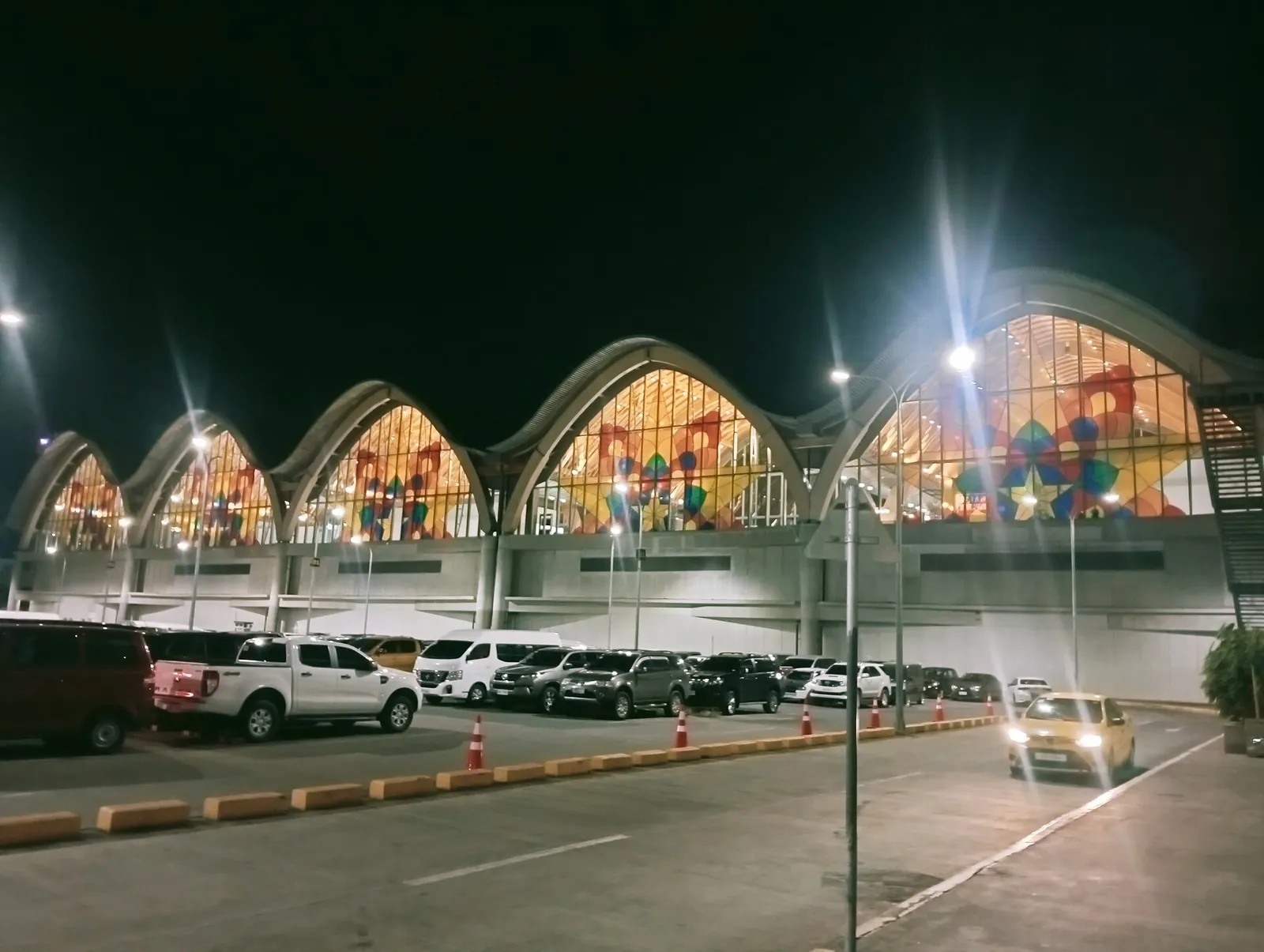Illuminated curved facade of Mactan-Cebu Airport Terminal 2
