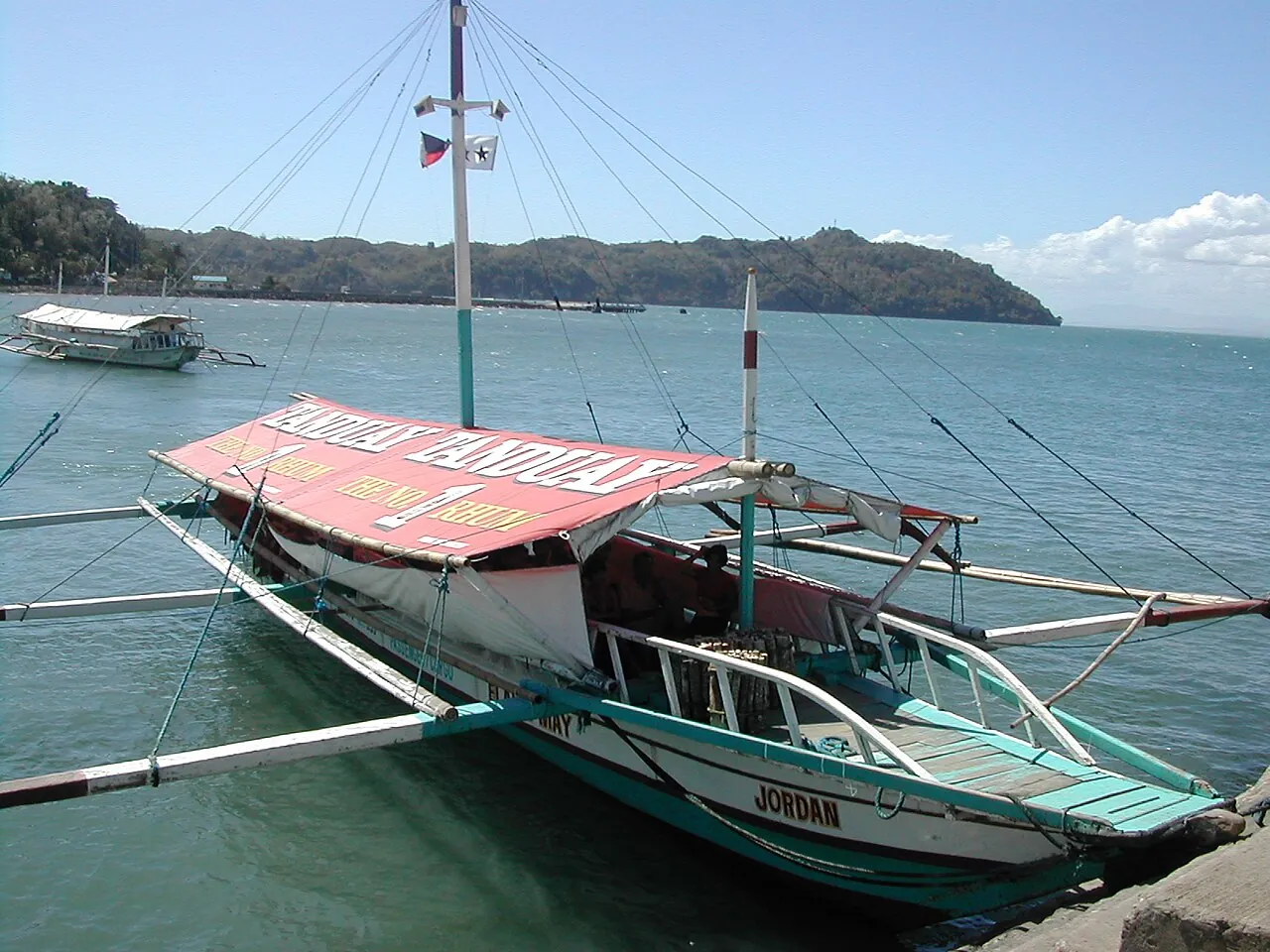 A passenger pumpboat on the water near Guimaras