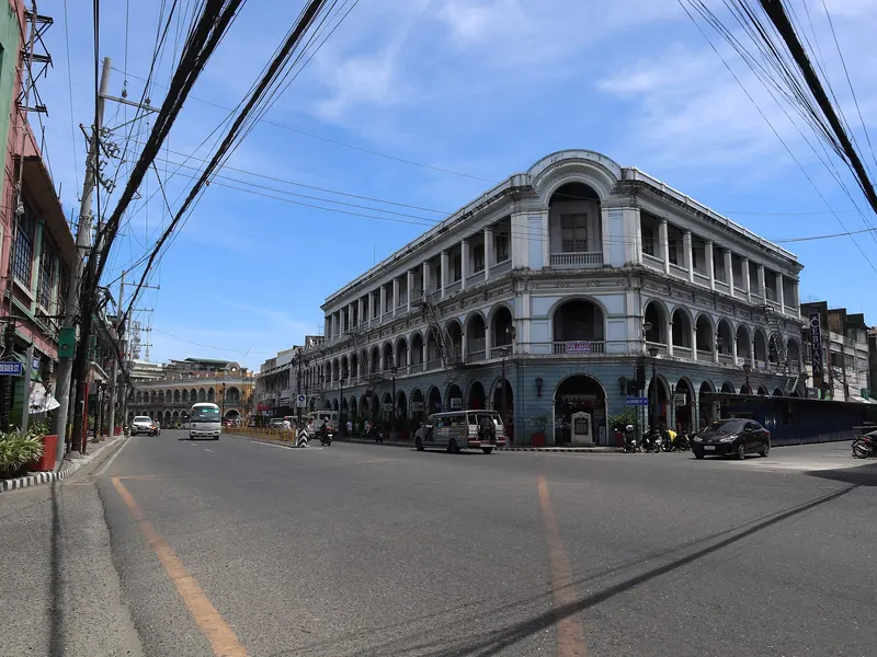 Historic corner building and blue sky at JM Basa and Aldeguer streets in Iloilo City