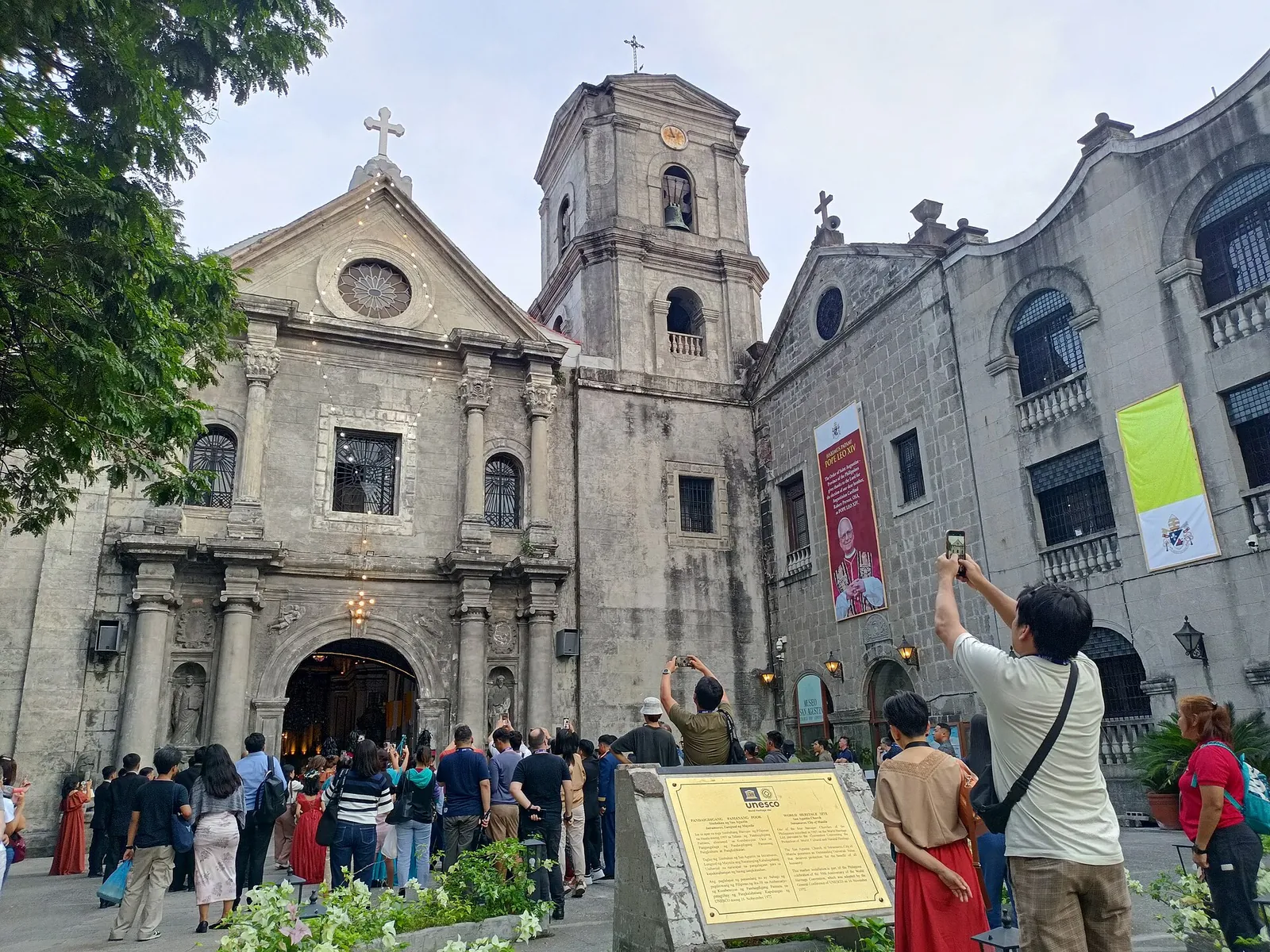 San Agustin Church facade and visitors in Intramuros, Manila
