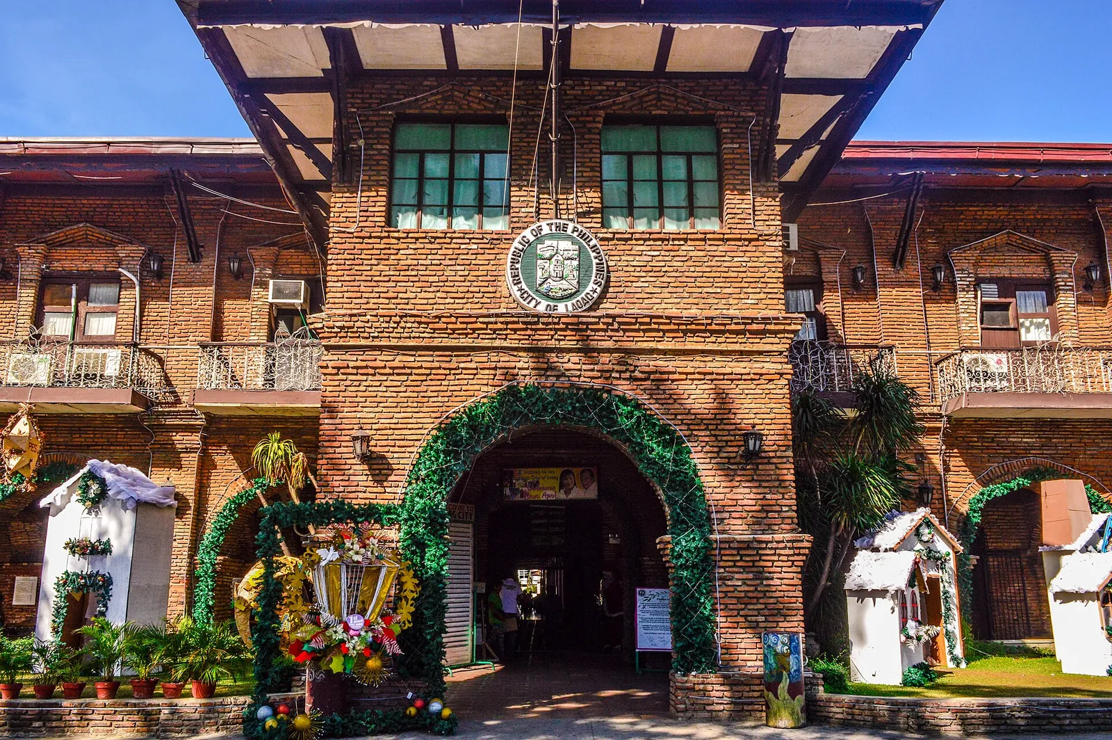 Brick facade and arched entrance of Laoag City Hall