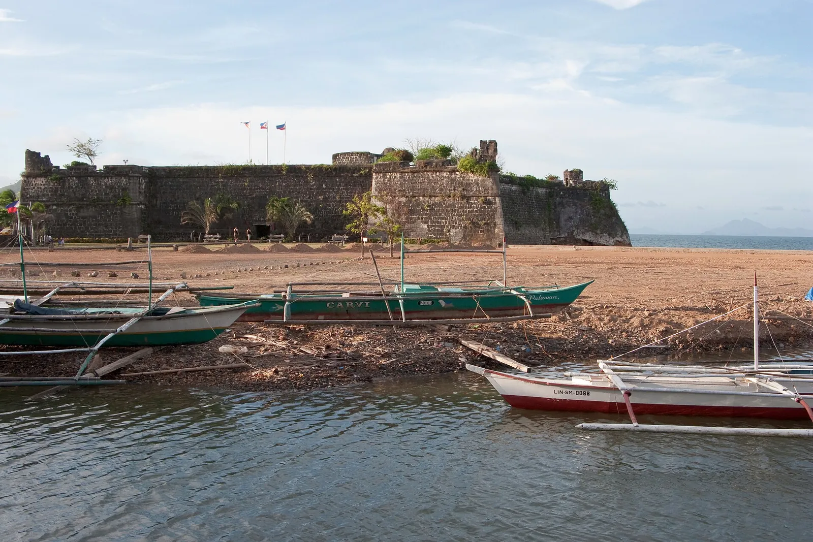 Banca boats beside the stone walls of Fort Santa Isabel in Taytay