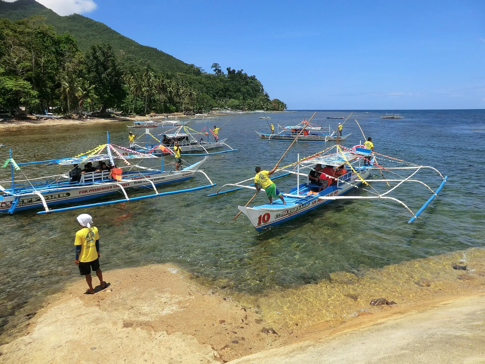 Outrigger boats beside the shore at Sabang, Puerto Princesa