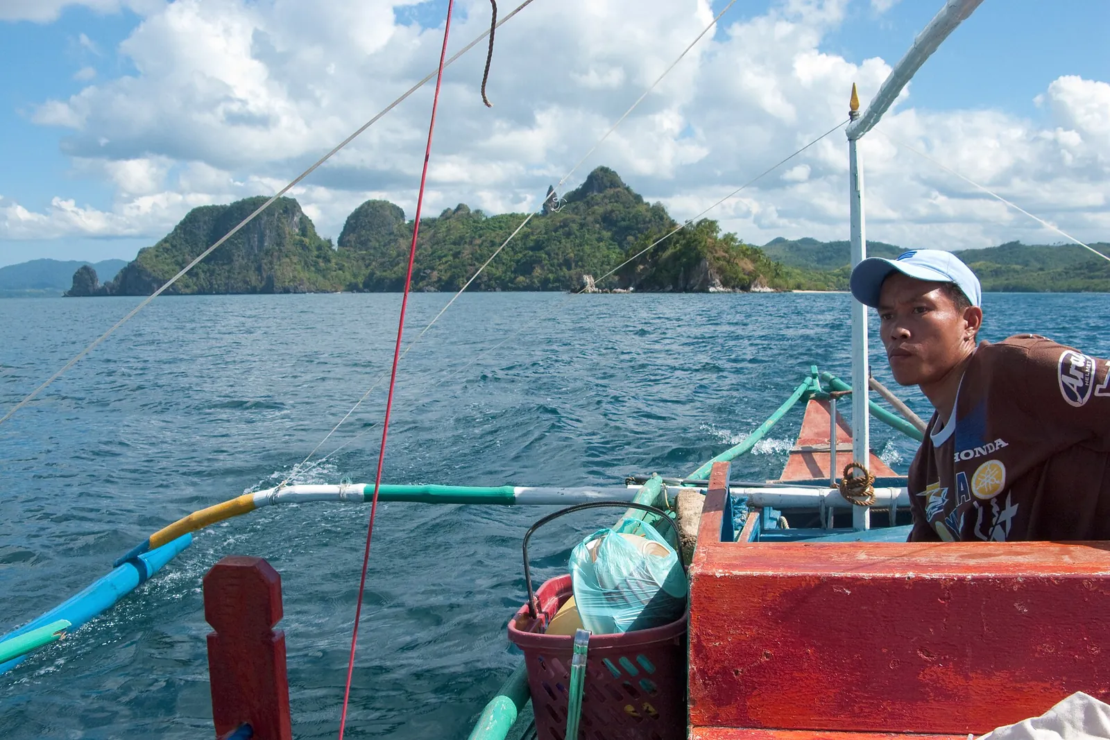 Passenger aboard a bangka in El Nido Bay, Palawan