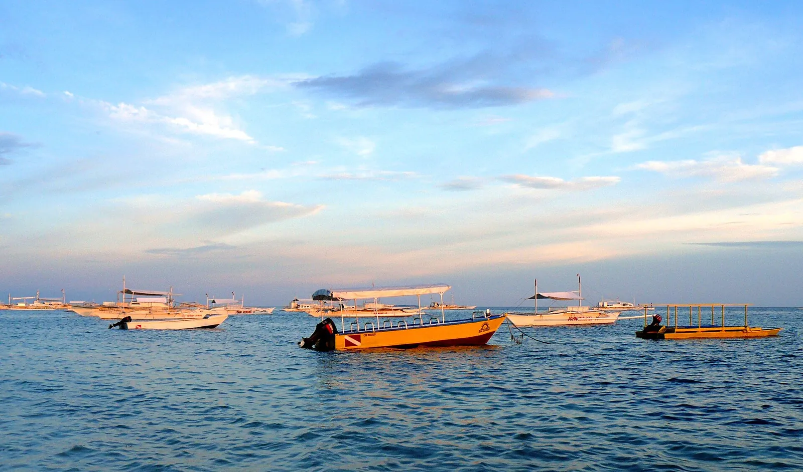 Outrigger boats on the water off Alona Beach, Panglao