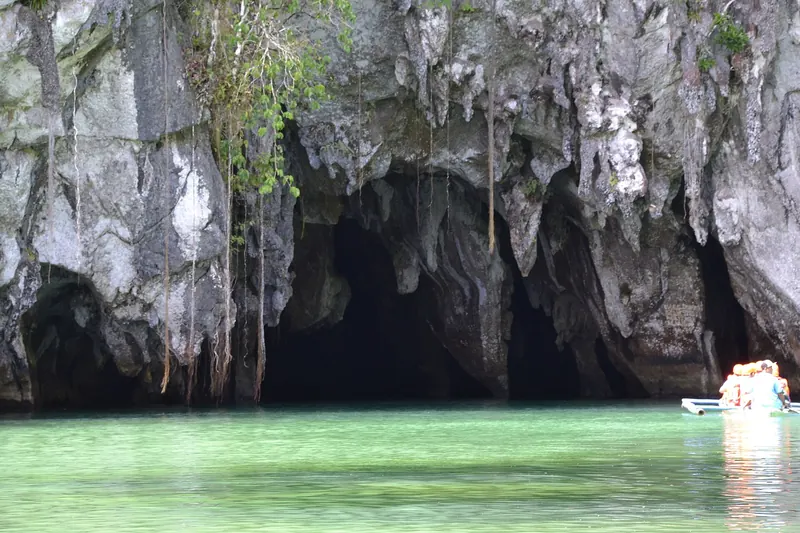 Green water and limestone entrance to the Puerto Princesa Underground River at Sabang