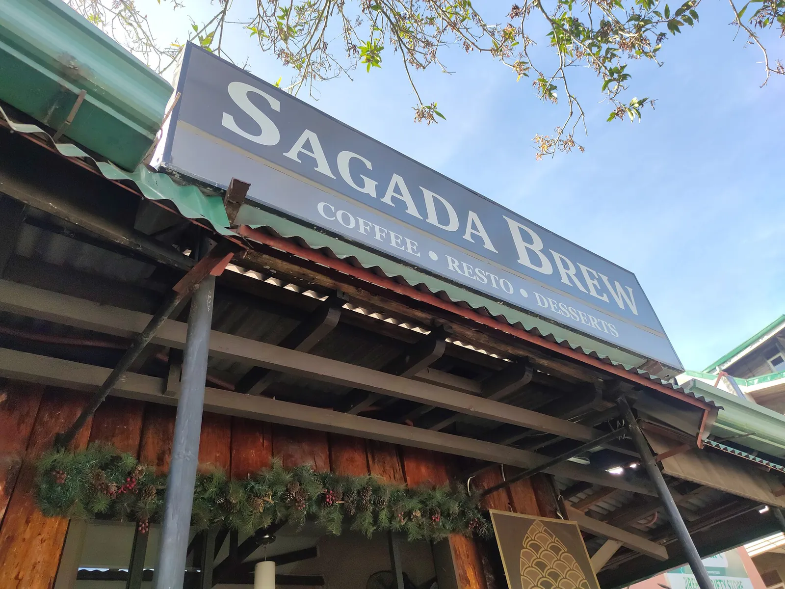 Sagada Brew sign above a wooden cafe frontage