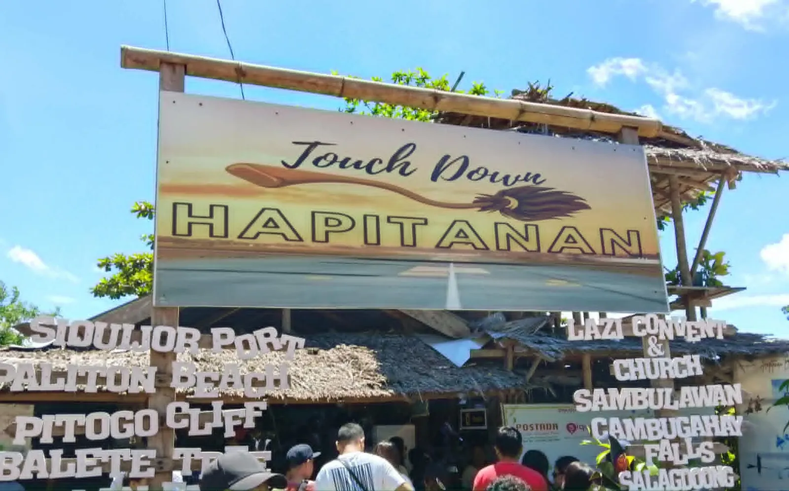 Hapitanan sign and café frontage beside a road on Siquijor