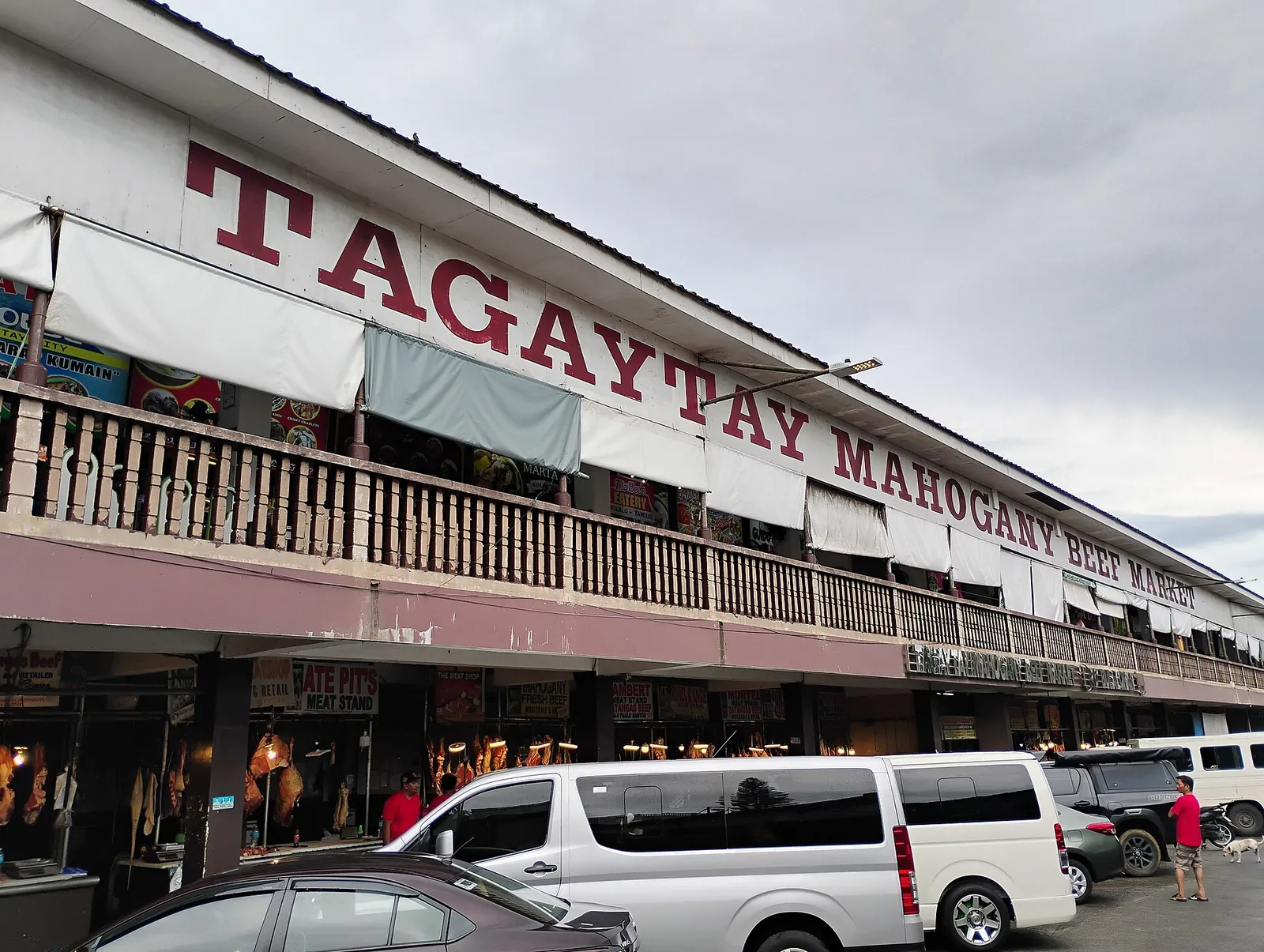 Tagaytay Mahogany Market building with parked vehicles in front