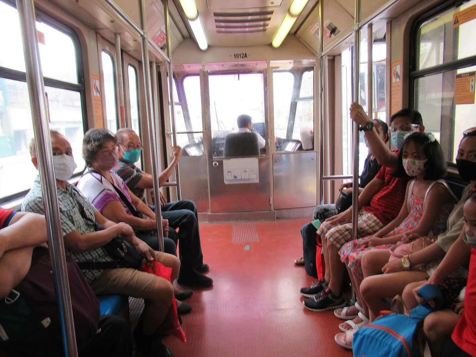 Passengers inside a Manila–Caloocan LRT train