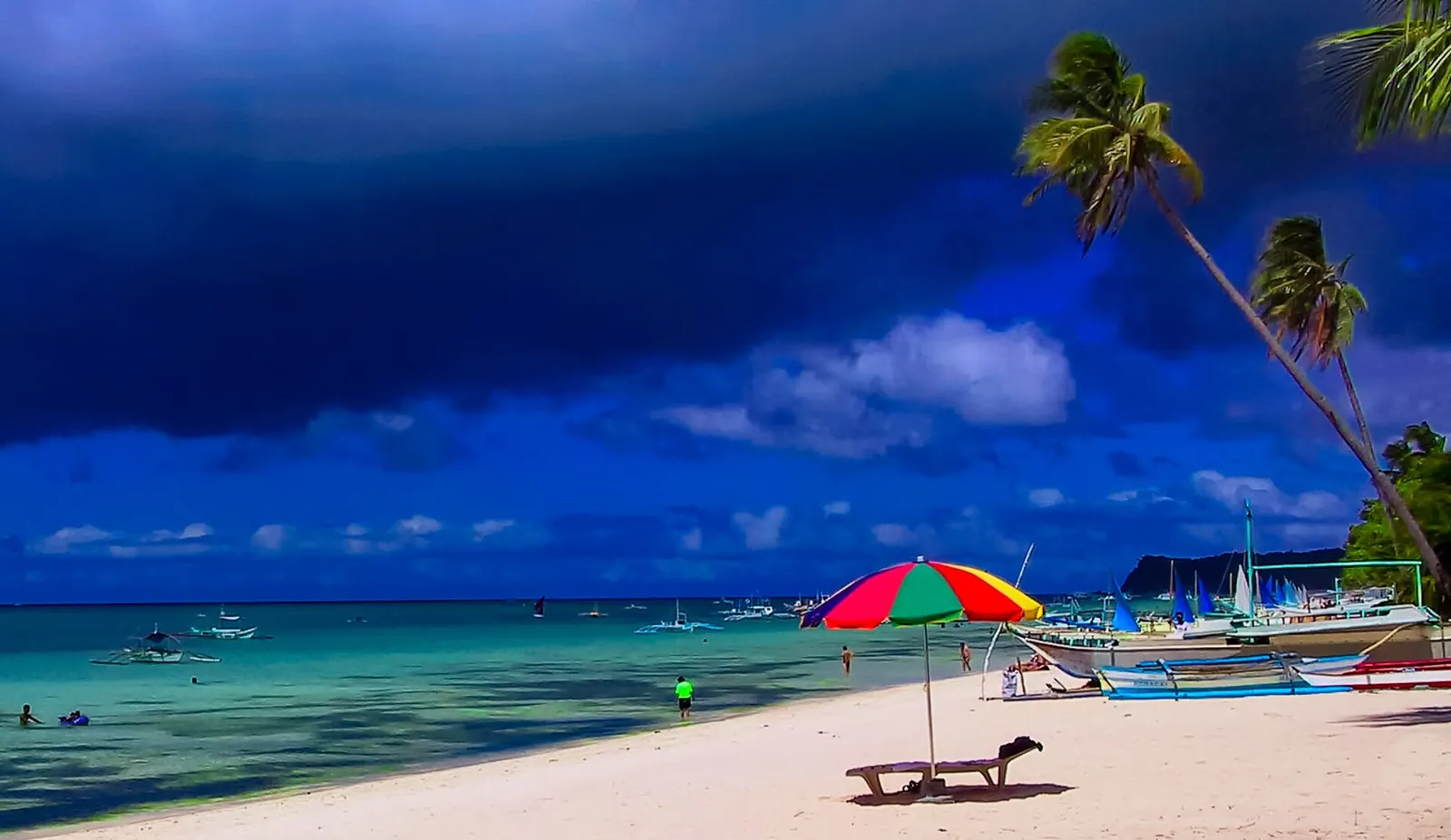 Beach umbrellas along Boracay coast