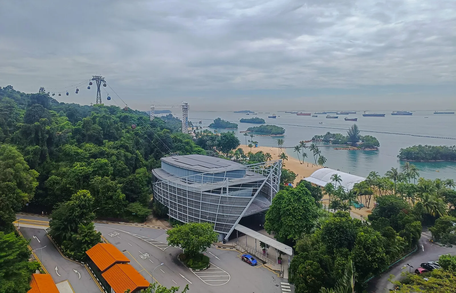 Sentosa seen from above, with the cable car line and the sea beyond