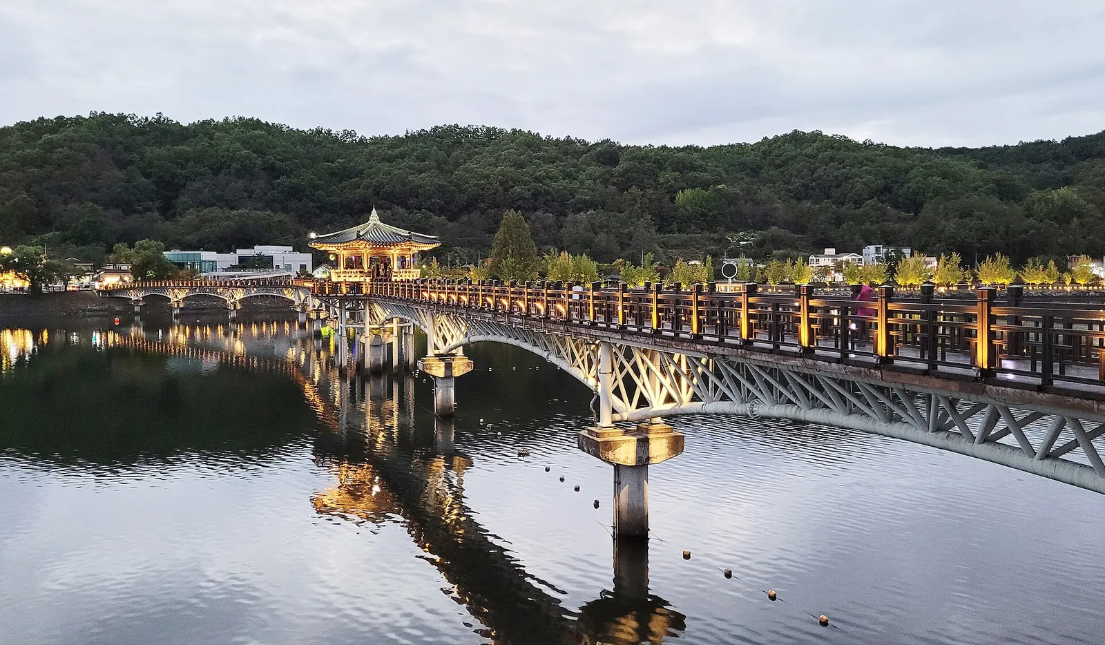 Woryeonggyo wooden bridge with a pavilion reflected in the water in Andong