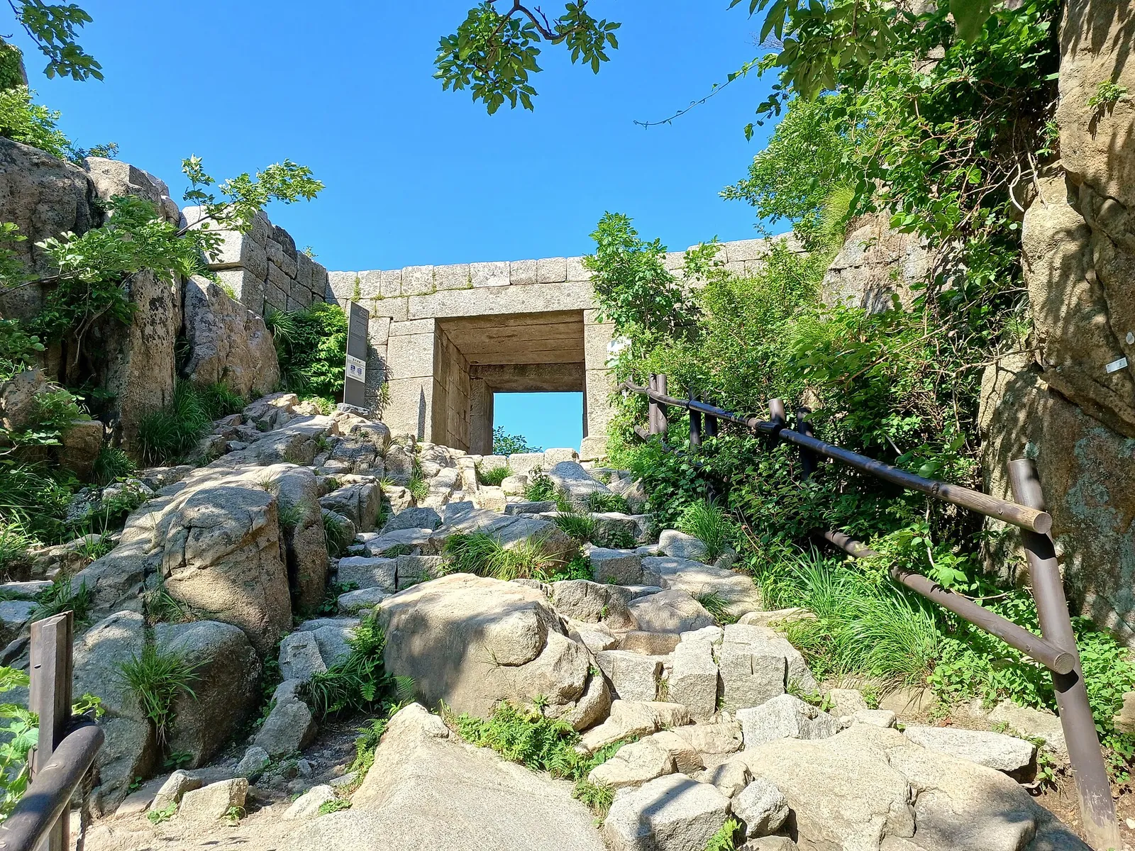 Stone gate of Baegunbongammun on a rocky trail below Baegundae, Bukhansan
