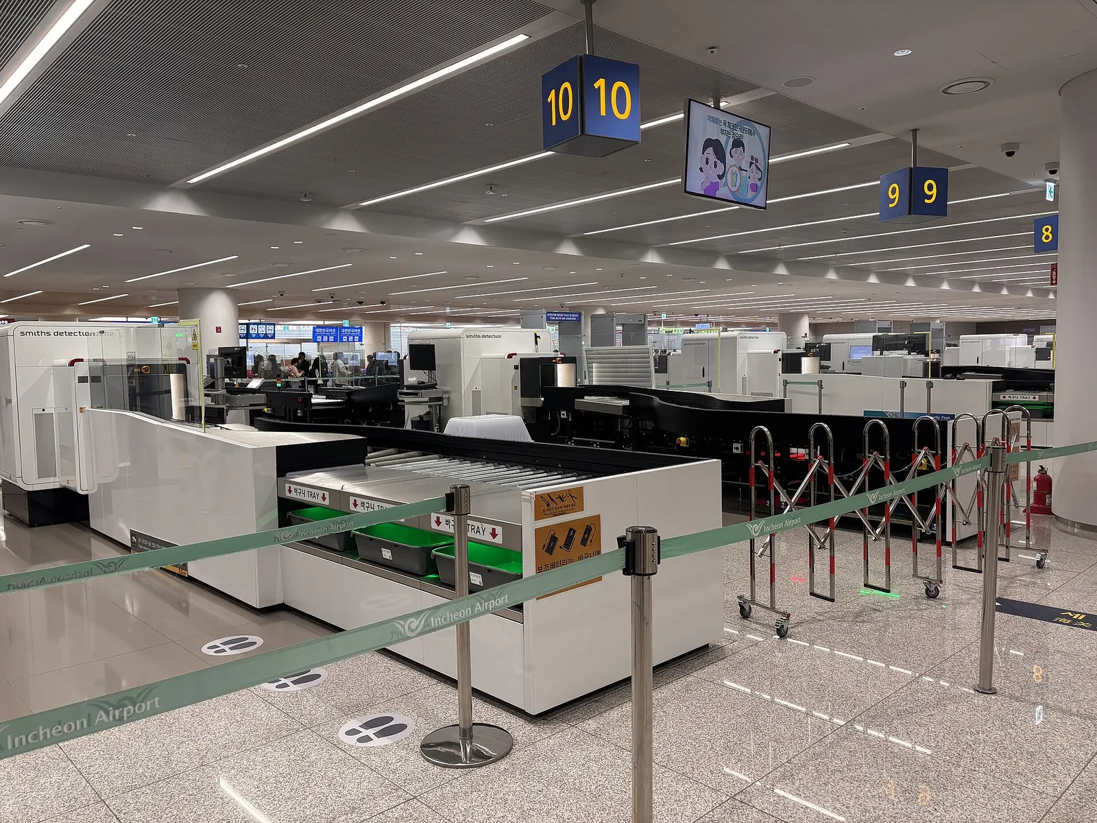 Bright, modern hall at Incheon International Airport with numbered counters