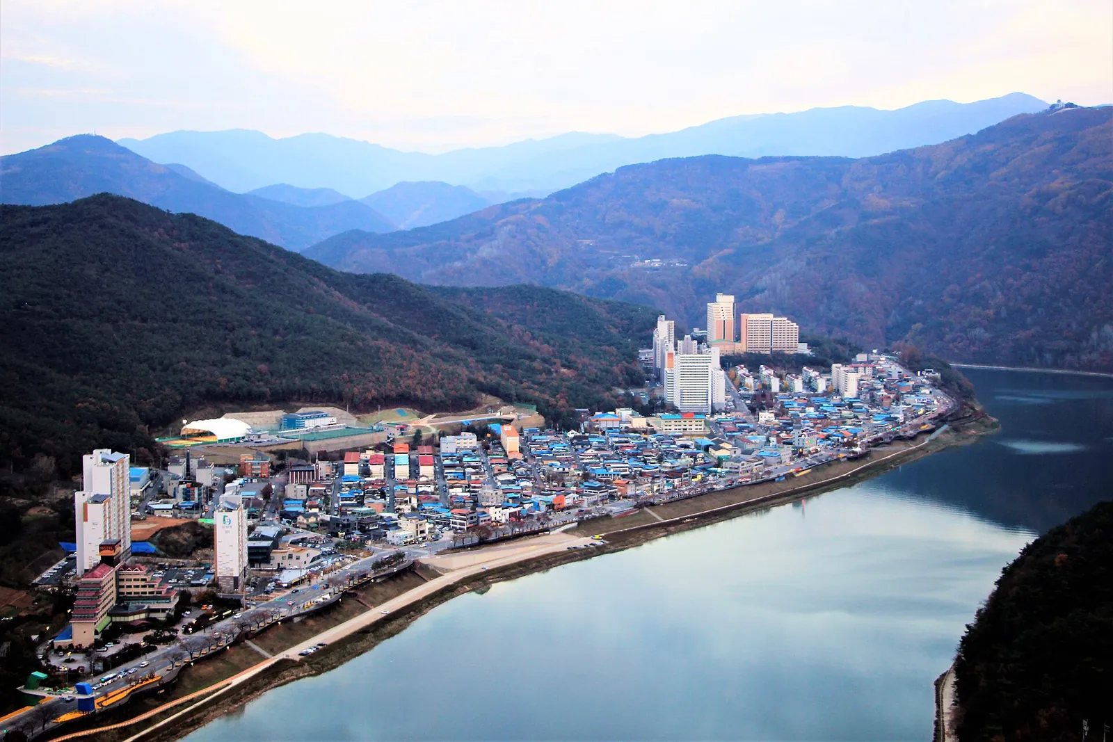 Downtown Danyang on a bend of the Namhangang River with mountains behind, seen from the Mancheonha Skywalk