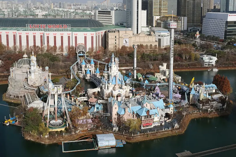 Lotte World's Magic Island with its fairy-tale castle and rides on Seokchon Lake in Jamsil, Seoul