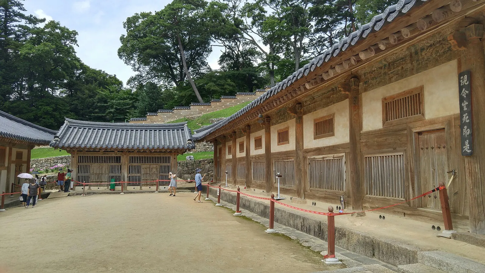 Long wooden storage halls of Janggyeong Panjeon at Haeinsa around a gravel courtyard