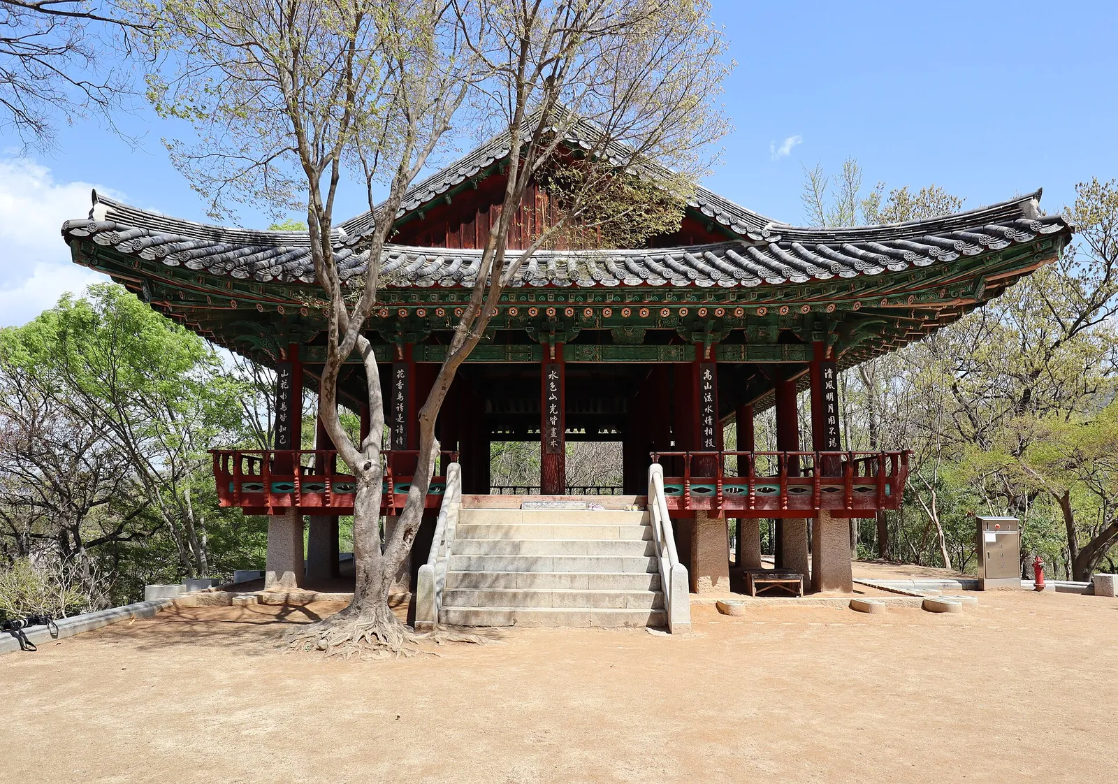 Omokdae pavilion with red railings and a tiled roof on a hilltop above Jeonju Hanok Village