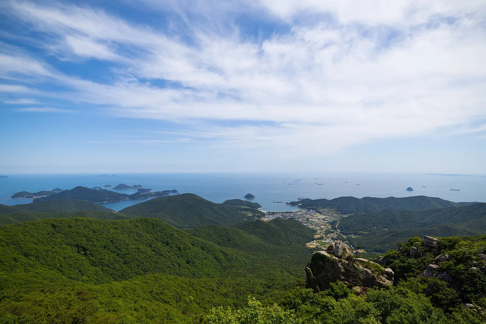 View from Geumsan over green ridges to the islands and bay below, Namhae