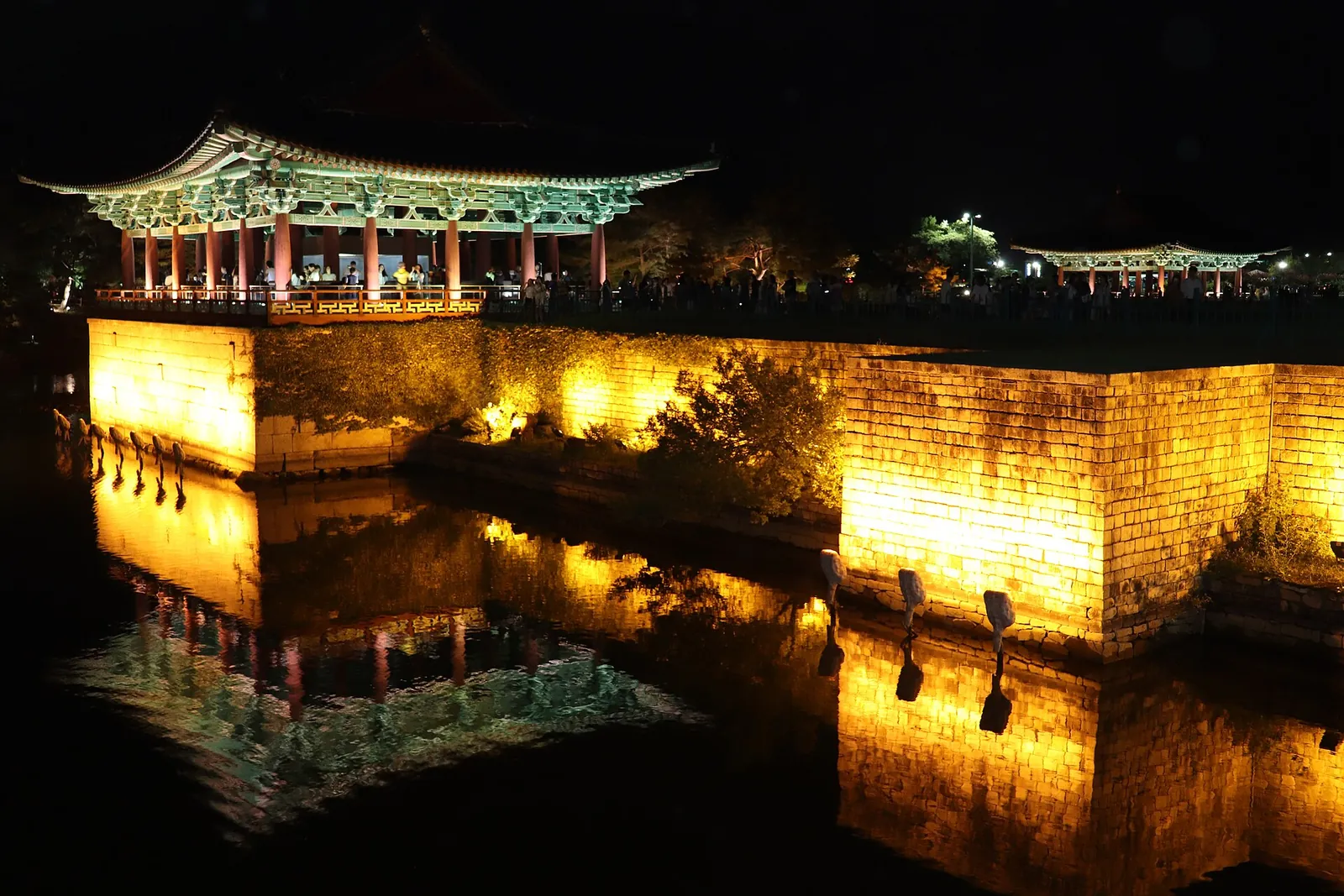 Pavilions of Donggung Palace lit up at night and reflected in Wolji Pond, Gyeongju