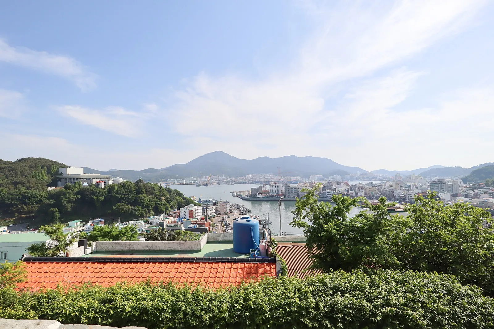 View from Dongpirang Village over the rooftops of Tongyeong towards the harbour and the hills of the islands