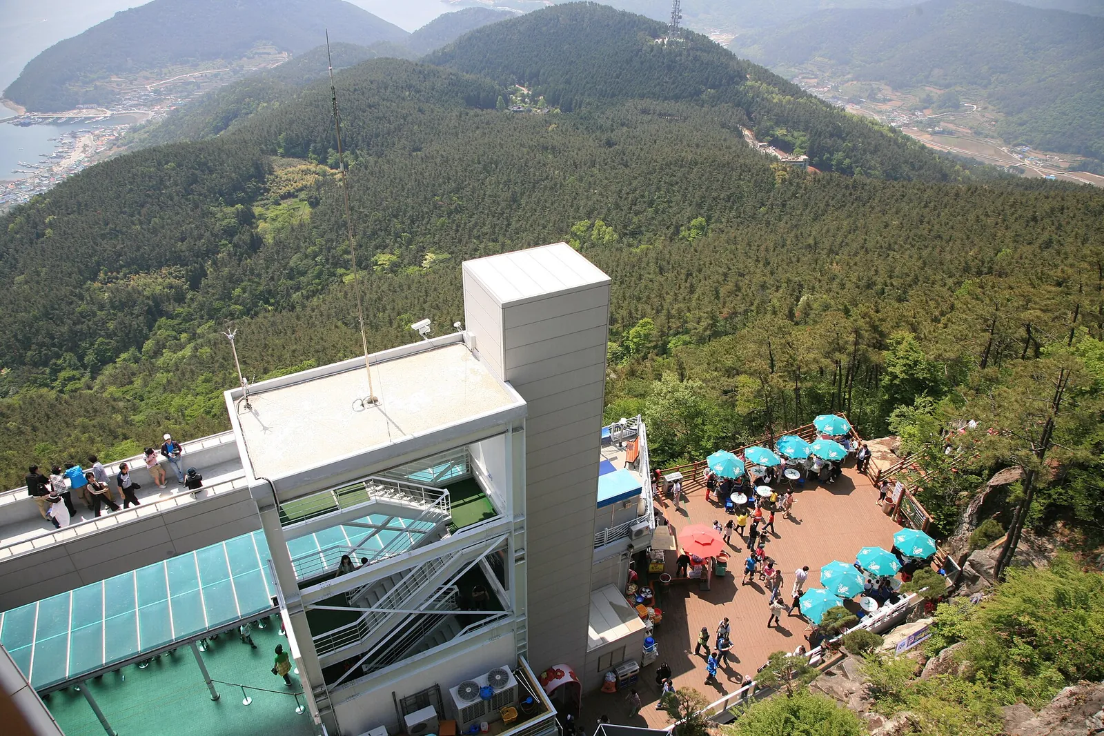Upper station of the Tongyeong Cable Car on Mireuksan with the forested hills and the sea of Hallyeohaesang behind