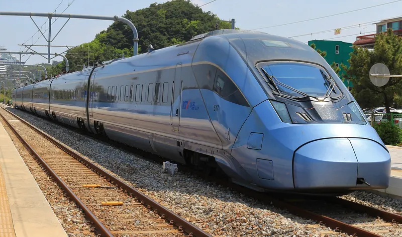 Blue KTX-Eum semi-high-speed train at Jeongdongjin Station under a clear sky