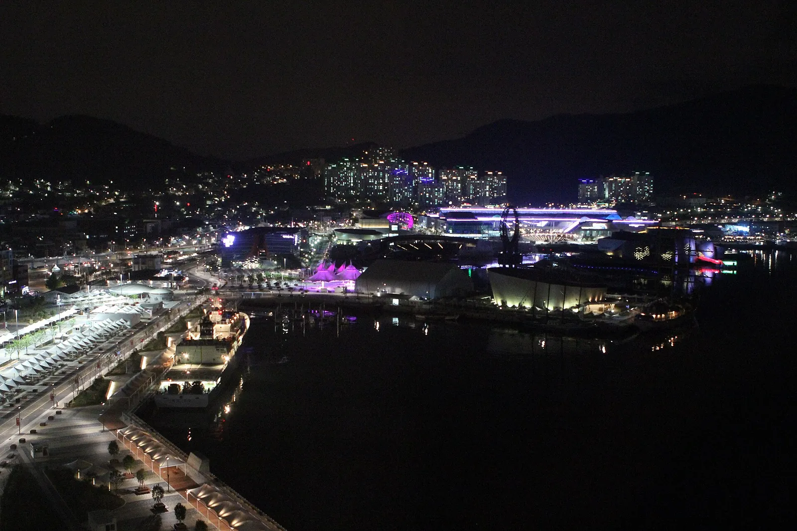 The Yeosu Expo waterfront and city lights at night, seen from above