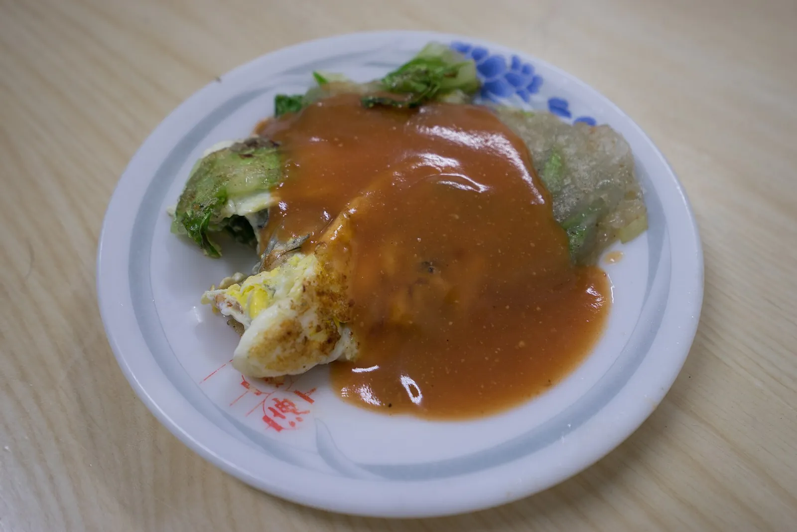 An oyster omelette served on a plate in Lukang