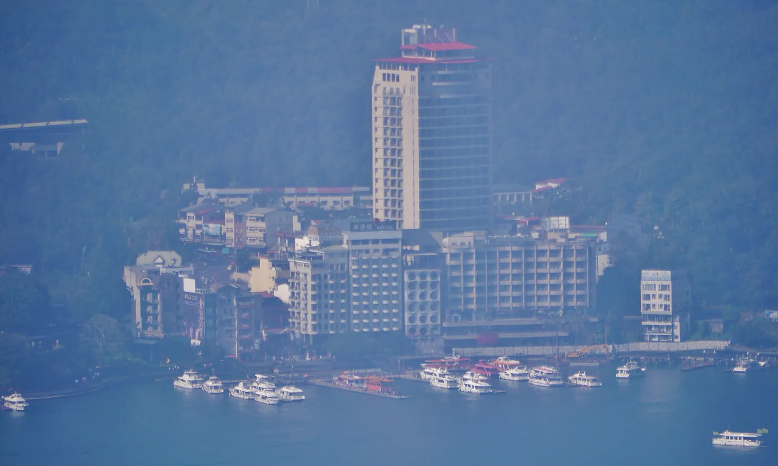 Hotel buildings beside Sun Moon Lake seen from the Ci En Pagoda
