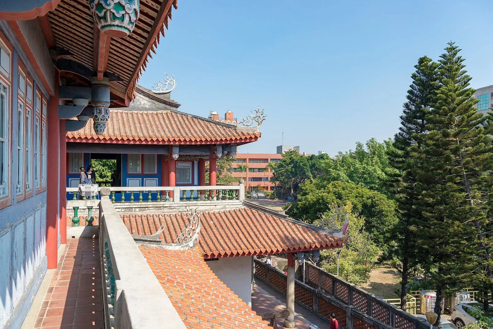 Tiled roofs and pavilions of Chihkan Tower in Tainan under a blue sky