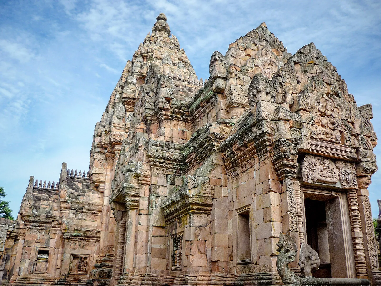 The pink sandstone central tower of Prasat Phanom Rung with carved pediments